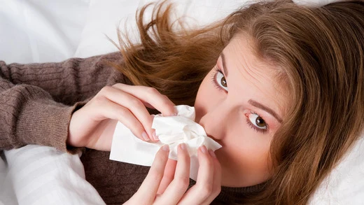 Woman with cold symptoms