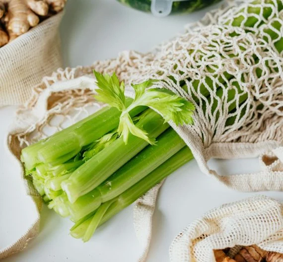 Celery stalks in mesh bag
