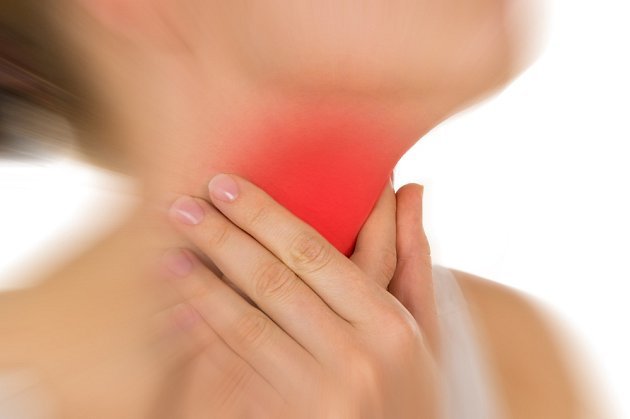 Person touching swollen neck node