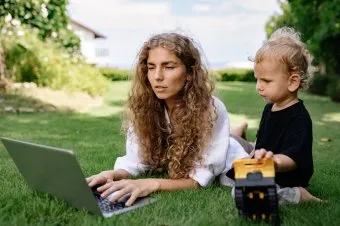 Woman working with child outdoors