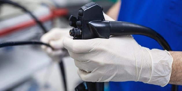 Endoscope in gloved hands