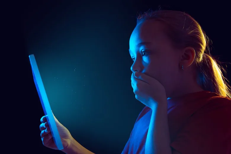 Girl looking at tablet screen