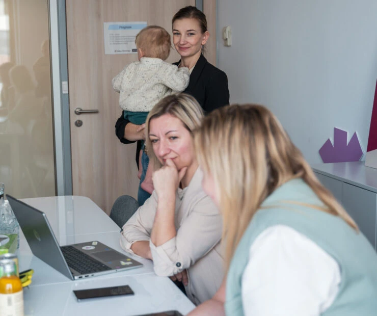 Women with baby in office