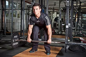 Man deadlifting barbell
