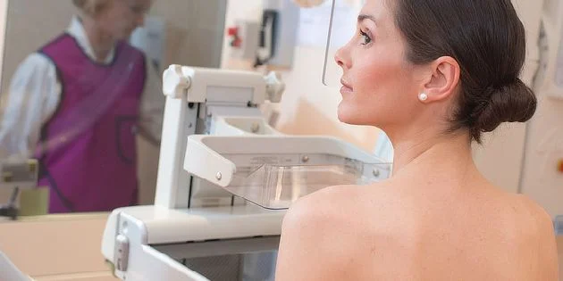Woman at mammogram machine